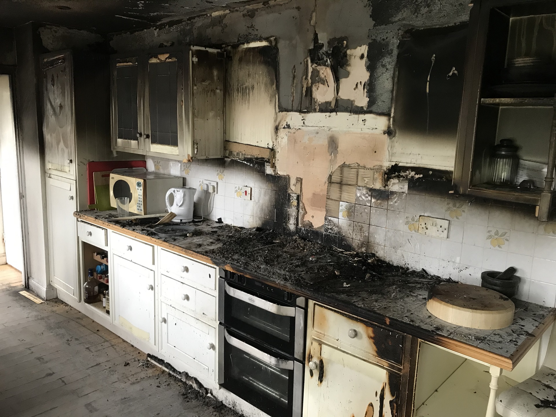 Smoke and soot damage in a kitchen after a fire